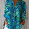 Patricia – Blusa azul con estampado natural